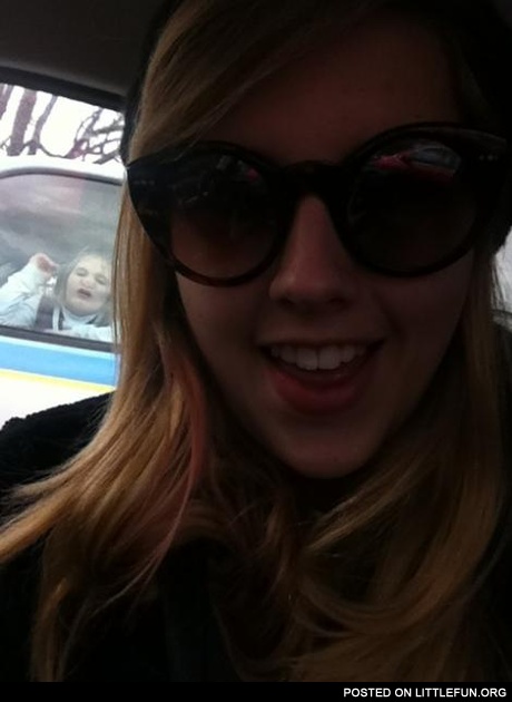 Photobomb. Girl in the car.