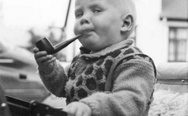 Haters gonna hate. A kid with tabacco pipe.