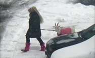 Blonde with a goat. Dat pink outfit.