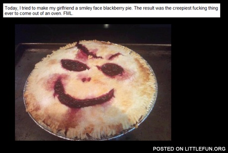 A smiley face blackberry pie