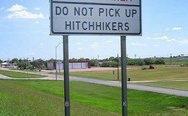 That  awkward sign you pass after you just picked up a hitchhiker