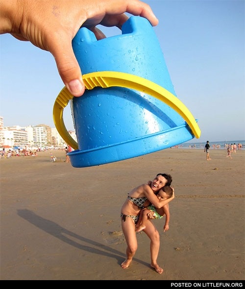On the beach. A huge blue bucket... or... wait...