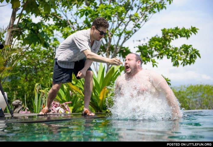 Feeding a fat guy in the pool