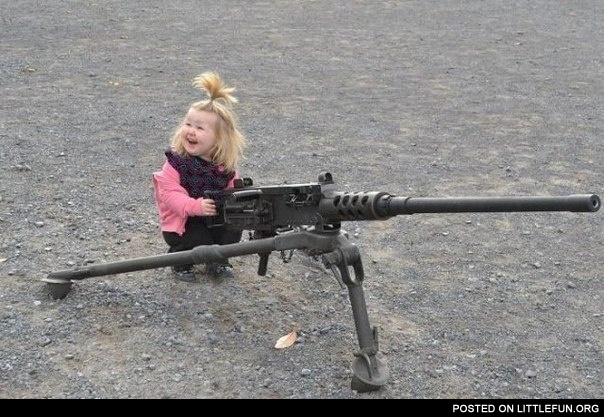 Little funny girl with a gun
