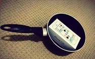 This is the evilest thing I've ever seen. Frying pan -> iPhone -> socks.